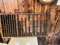 Full view of wood typeset drawer showing compartments