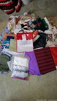 overview of assorted linens, towels and packaged items