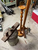 group view: milk can, wooden plane, coat stand, two fishing rods