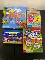 All four boxed games arranged together