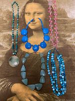 All five necklaces displayed on background