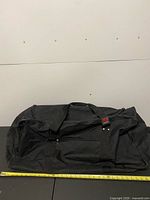 Full view of black Lowry Sports duffel bag