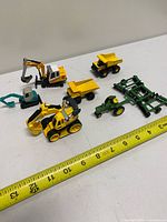 Group shot of all seven die-cast vehicles