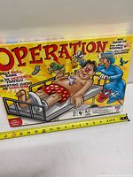Front of sealed Operation game box