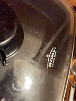 Close view of Rival logo on glass lid of electric skillet