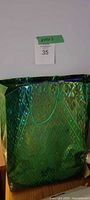 Green holographic gift bag with lot tag