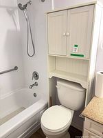 Full view of cabinet installed over toilet