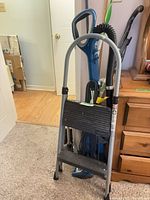 Shark vacuum and two-step ladder