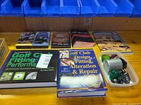 Overview of all books, videos and accessories on workbench