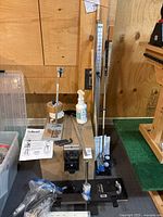 Overall lot view with alignment stand, vise, fitting system, putters and accessories