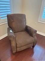 Front view of La-Z-Boy brown floral push back recliner