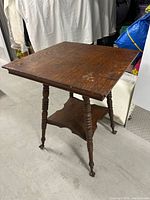 Full view of antique oak two-tier table