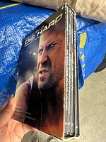 Front of slipcase showing Die Hard Collection artwork and DVDs inside