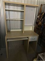 Full view of IKEA MICKE desk with hutch, keyboard tray, drawer and open cubby