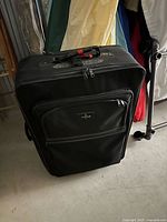 Front view of black Atlantic rolling suitcase