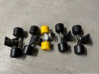 Top view of five skateboard trucks with wheels