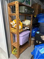 Full view of wooden shelving unit in storage