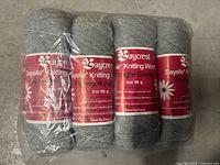 Front view of sealed package showing four skeins with labels