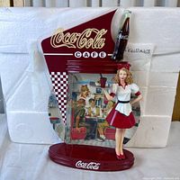 Full view of Coca-Cola Café figurine display against packaging