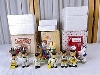 full lot showing eight figurines and boxes