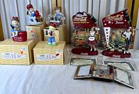 Full lot showing plates, figurines, certificates, display frames and boxes