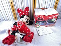 Figure, box and instruction sheet on table