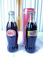 Front view of both bottles and display tube