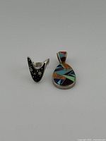 Front view of sterling ring and pendant showing inlay patterns