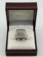 Ring displayed in branded box
