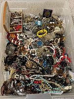 Top view of bin showing large mix of jewelry