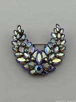 Front view showing aurora borealis and amethyst rhinestones in crescent design