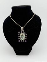 Pendant necklace on display bust