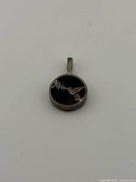 Front view showing hummingbird motif on black background