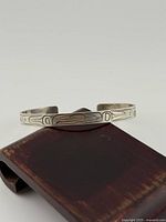 Front view of sterling Coast Salish engraved cuff bracelet