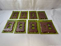 All eight packaged hard maple wall plates displayed