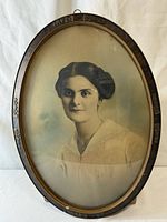 Front view of oval framed portrait