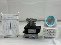 Front view showing armoire, stove, vanity