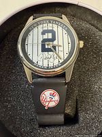 Front view of watch showing dial design and strap logo