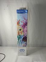 Front of boxed Diamond Dotz Rainbow Zebras kit