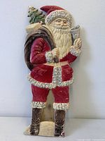 Front view of embossed cardboard Santa decoration showing full figure
