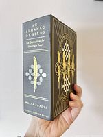Slip-cased Almanac of Birds boxed set held in hand