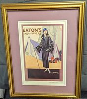Framed numbered Eaton's Fall & Winter 1924 catalogue cover print, full front view
