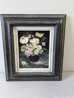 front view of framed floral oil painting