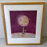 Front view of framed signed numbered print