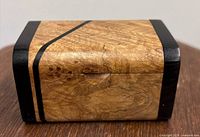 Front view of maple burl box with blackwood ends and stripe