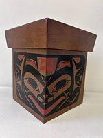 Three-quarter view showing lid and Haida artwork