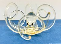Front view of clear and amber glass octopus figurine