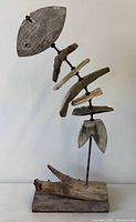 Full view of driftwood fish skeleton sculpture on base