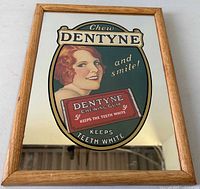 Full front view of framed Dentyne advertising mirror