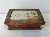 Top view showing painted Golden Gate Bridge scene and decorative border